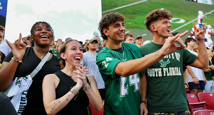 USF students cheering during a football game.